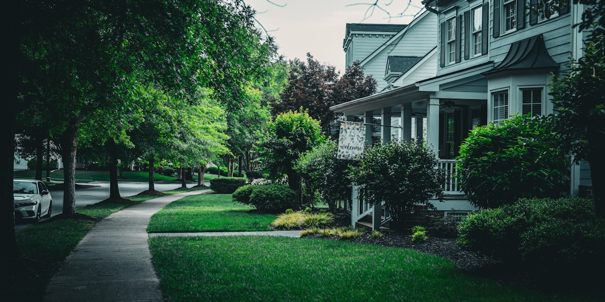 Well-maintained residential neighborhood with green lawns and landscaping