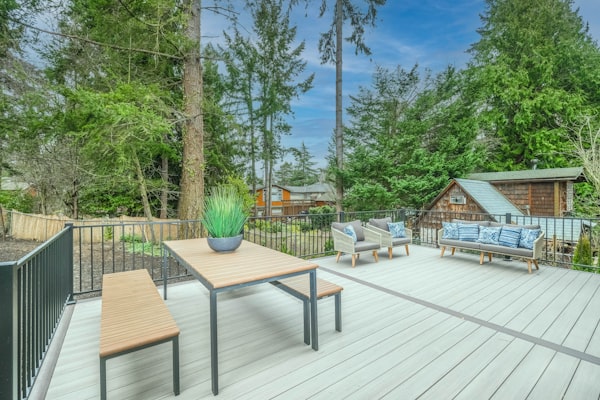 Clean outdoor deck with furniture after professional pressure washing
